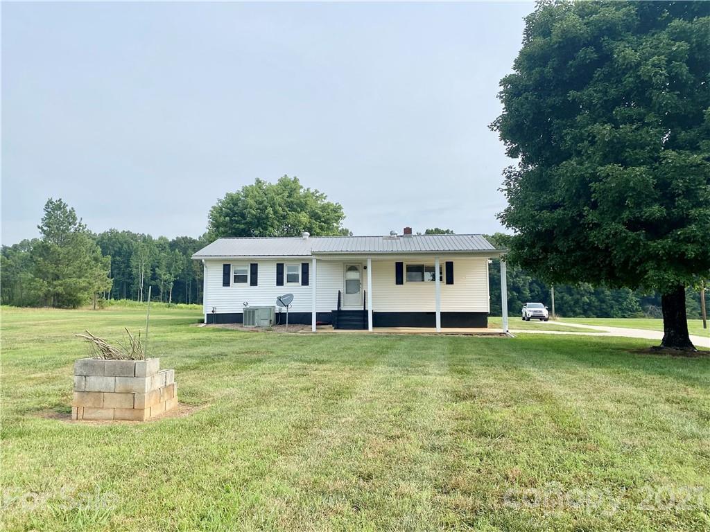 127 Countryside Road Harmony, NC 28634 - Photo 22 of 27 a view of a house with a big yard
