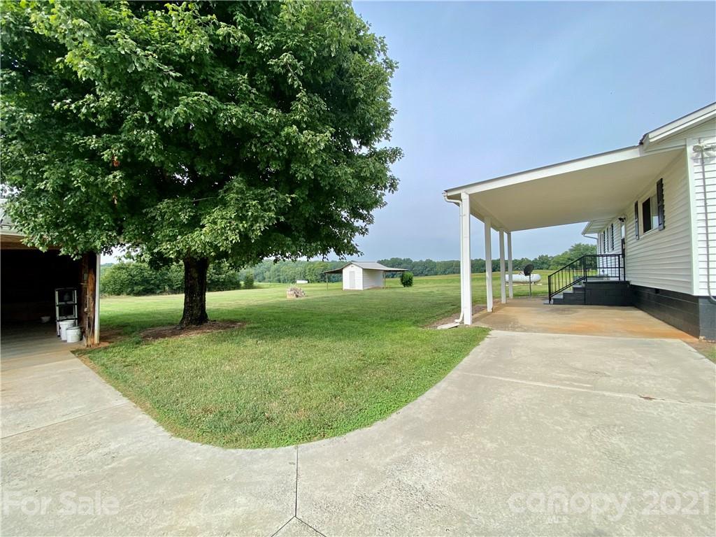 127 Countryside Road Harmony, NC 28634 - Photo 26 of 27 a view of a backyard with a garden and entertaining space