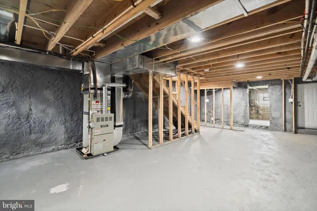 a view of an empty room with wooden walls