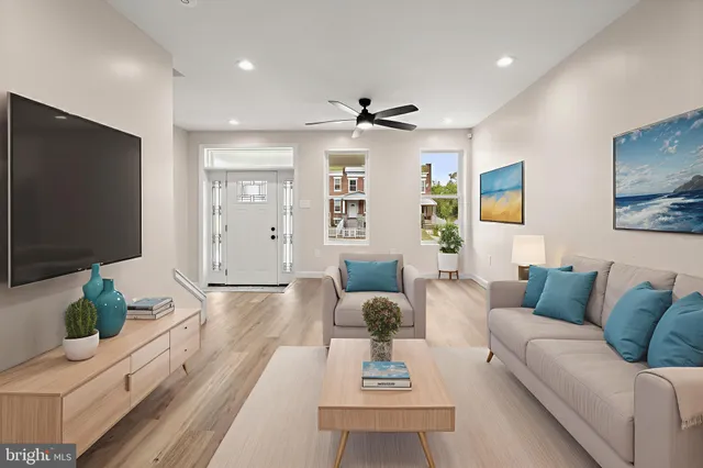 a living room with furniture and a flat screen tv