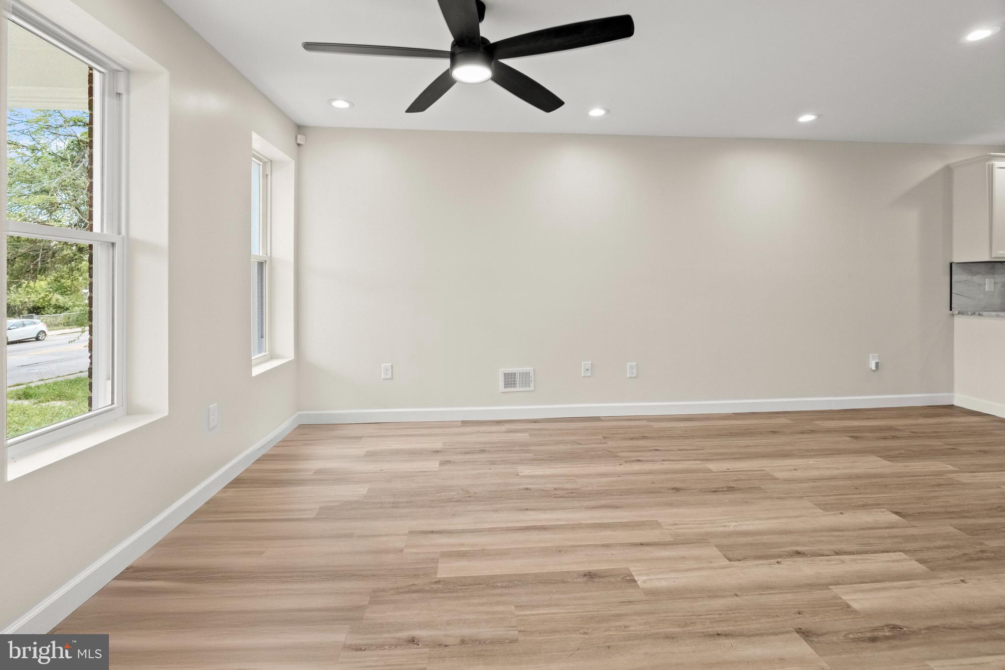 2815 West Cold Spring Lane Baltimore, MD 21215 - Photo 5 of 37 wooden floor in an empty room with a window