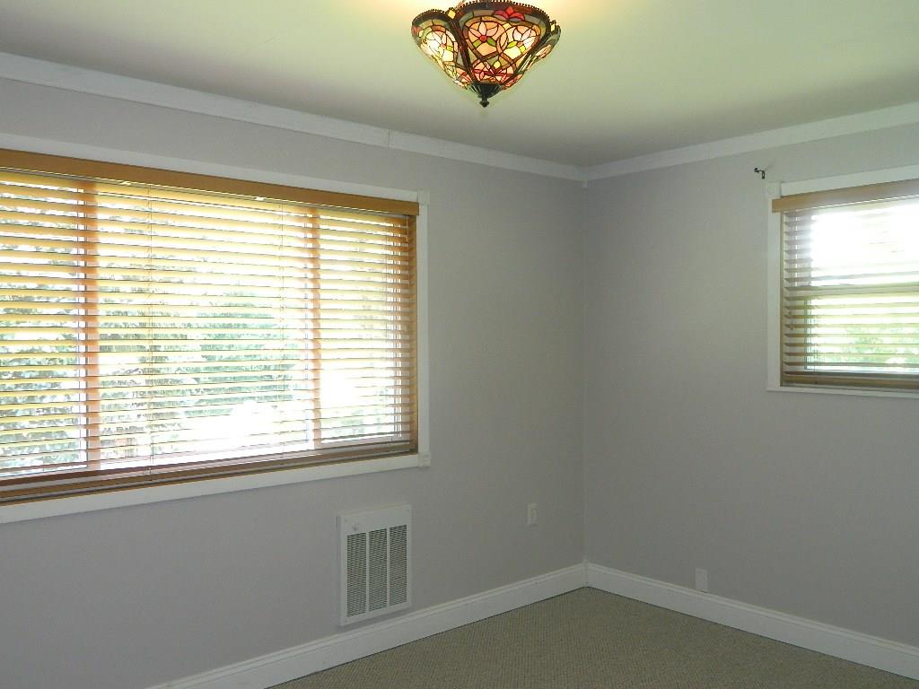 590 Alamae Lakes Road Washington, PA 15301 - Photo 22 of 25 Bedroom 1 features new wall-to-wall carpet, large closet and lots of natural light.