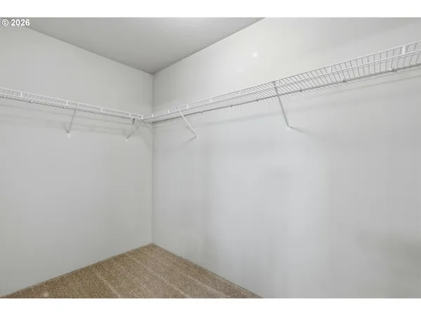 a view of a room with racks on the wall