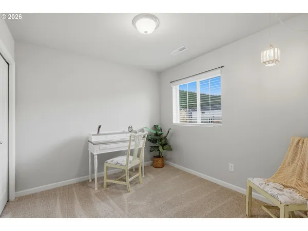 a workspace with furniture and a window
