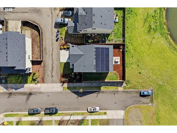 an aerial view of residential houses with outdoor space