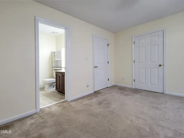 a bathroom with a sink a toilet and vanity