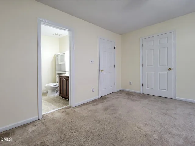 a bathroom with a sink a toilet and vanity