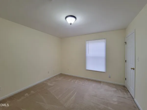 a view of room with a ceiling fan