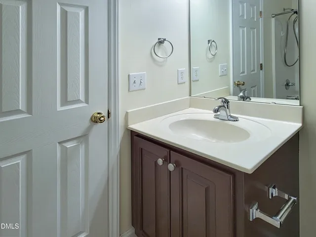 a bathroom with a bath tub with a shower
