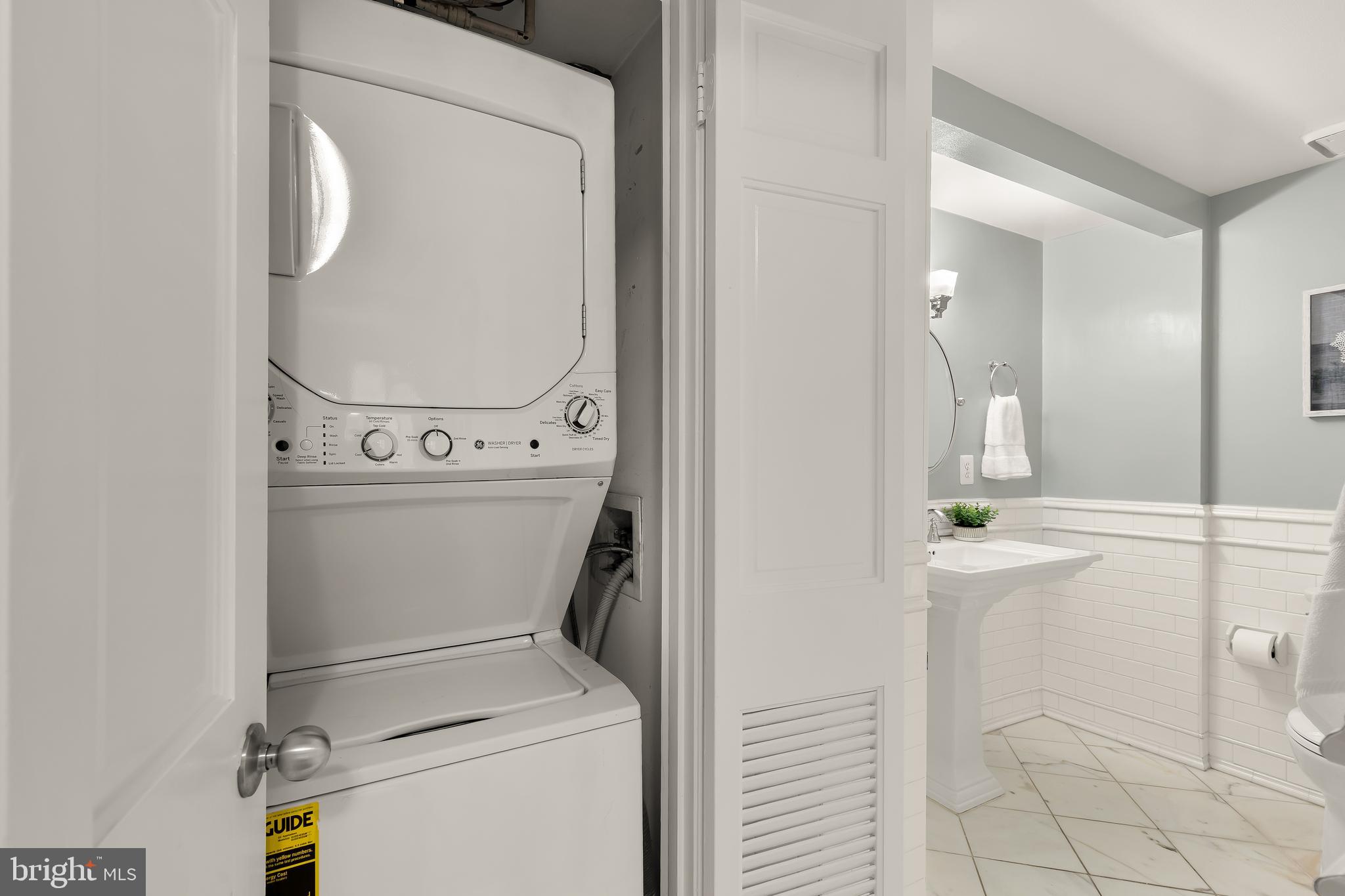 110 Cameron Street, Unit CS102 Alexandria, VA 22314 - Photo 10 of 24 a utility room with dryer and washer