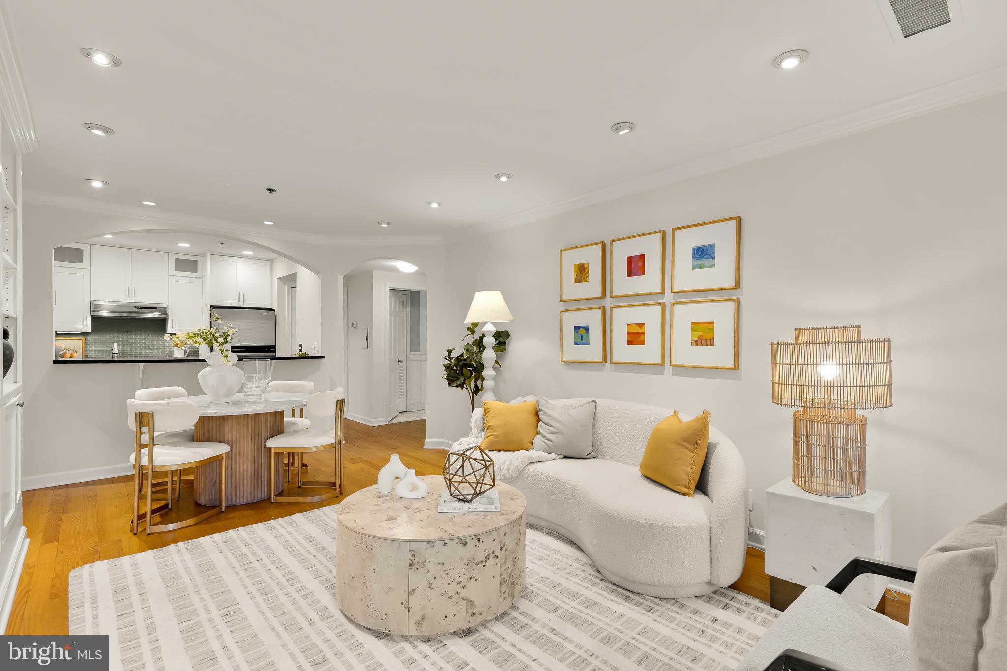 110 Cameron Street, Unit CS102 Alexandria, VA 22314 - Photo 2 of 24 a living room with furniture kitchen and a table