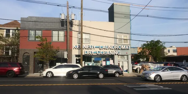 a view of a cars parked in front of a building