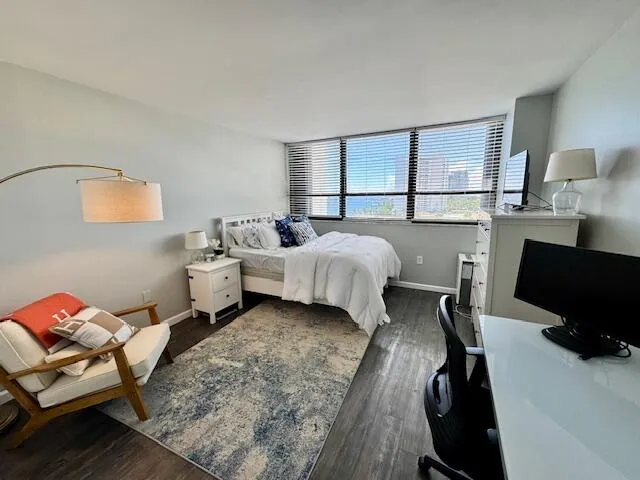 a bed room with a bed and a window