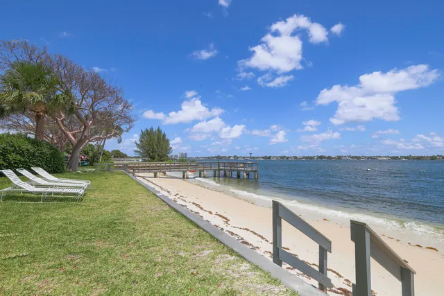 a view of a lake with a city skyline in the background