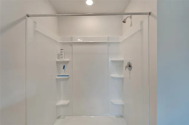 a view of a bathroom with a sink and mirror
