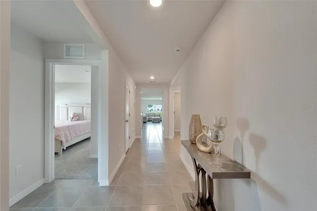 a view of a hallway with wooden shelves