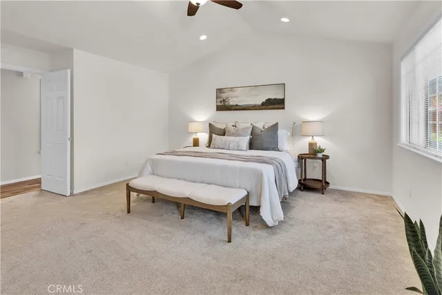 a bedroom with a bed and a table