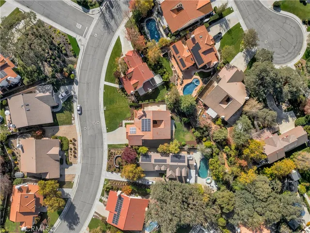 an aerial view of residential house with outdoor space and parking