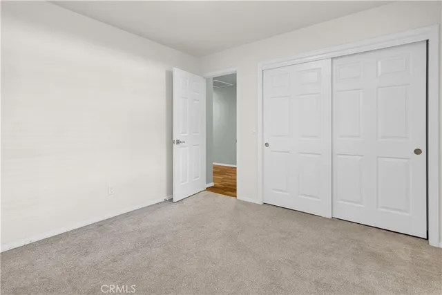 a view of an empty room and entryway