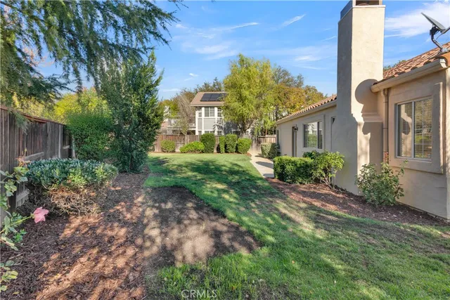 a view of a pathway both side of house