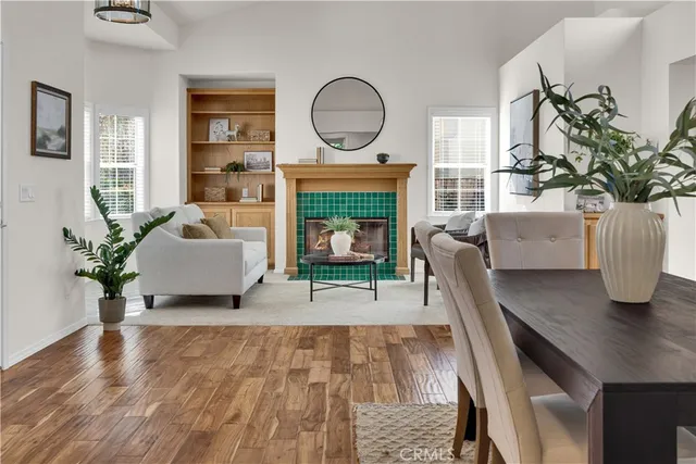 a living room with furniture fireplace and potted plant