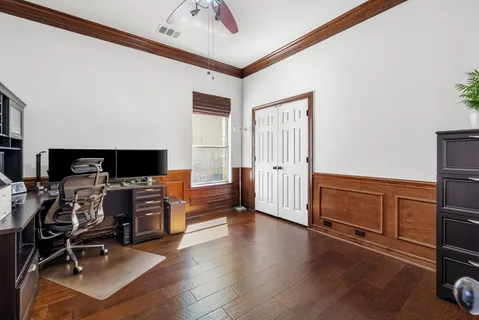 a view of a livingroom with furniture and a flat screen tv