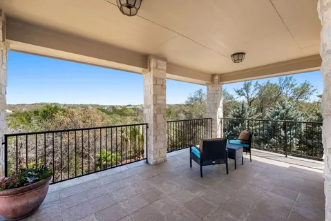 a view of a chairs and table in patio