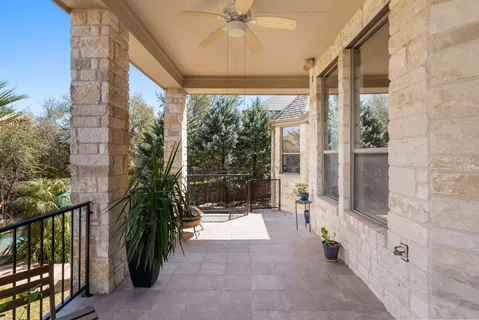 a porch with a glass door and glass door