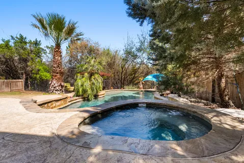 a view of a house with swimming pool
