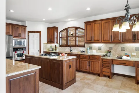 a kitchen with a sink stove and cabinets