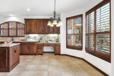 a kitchen with a stove a sink and a refrigerator