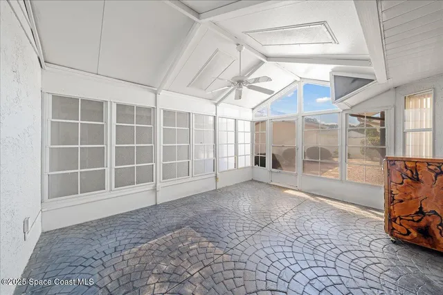 a view of empty room with windows