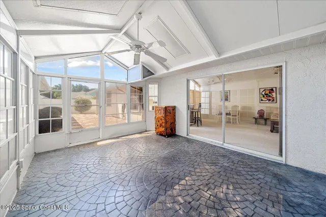 a view of a big room with wooden floor and door