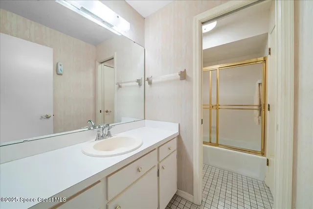 a bathroom with a sink double vanity and a mirror