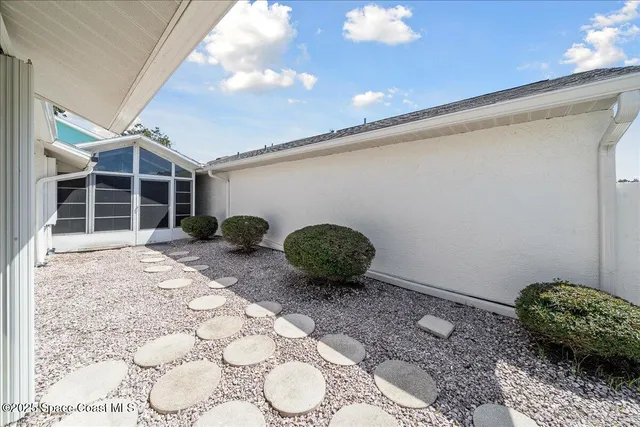a house view with a backyard space