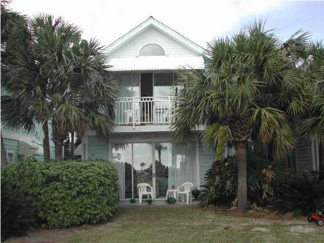 Nantucket Cottage, Unit 6 Destin, FL 32541 - Photo 2 of 10 a front view of a house with a yard garage and outdoor seating