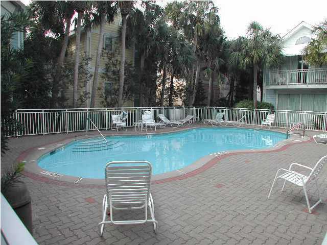 Nantucket Cottage, Unit 6 Destin, FL 32541 - Photo 3 of 10 a view of a swimming pool with a lounge chair