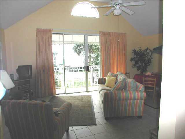 Nantucket Cottage, Unit 6 Destin, FL 32541 - Photo 4 of 10 a living room with furniture and a window