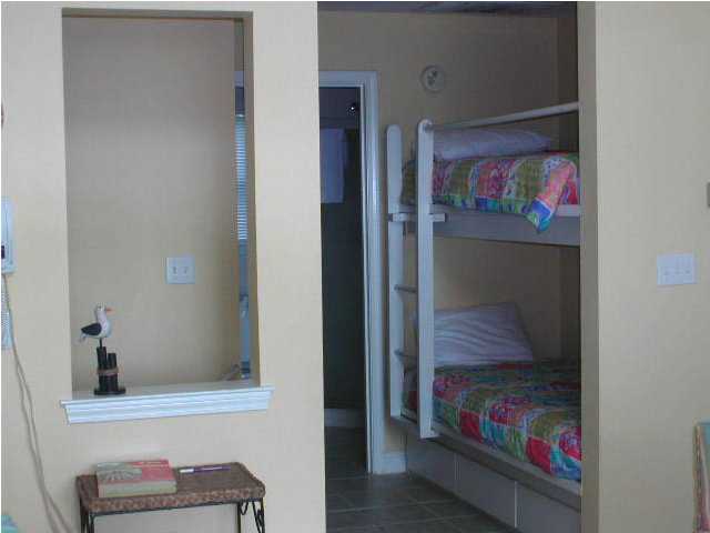 Nantucket Cottage, Unit 6 Destin, FL 32541 - Photo 7 of 10 a view of a hallway with workspace