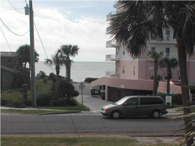 Nantucket Cottage, Unit 6 Destin, FL 32541 - Photo 8 of 10 a car parked in front of a house