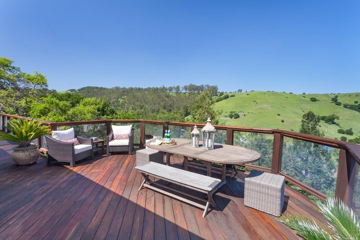 26 Wimbledon Way San Rafael, CA 94901 - Photo 1 of 1 a view of a balcony with mountain view and wooden floor