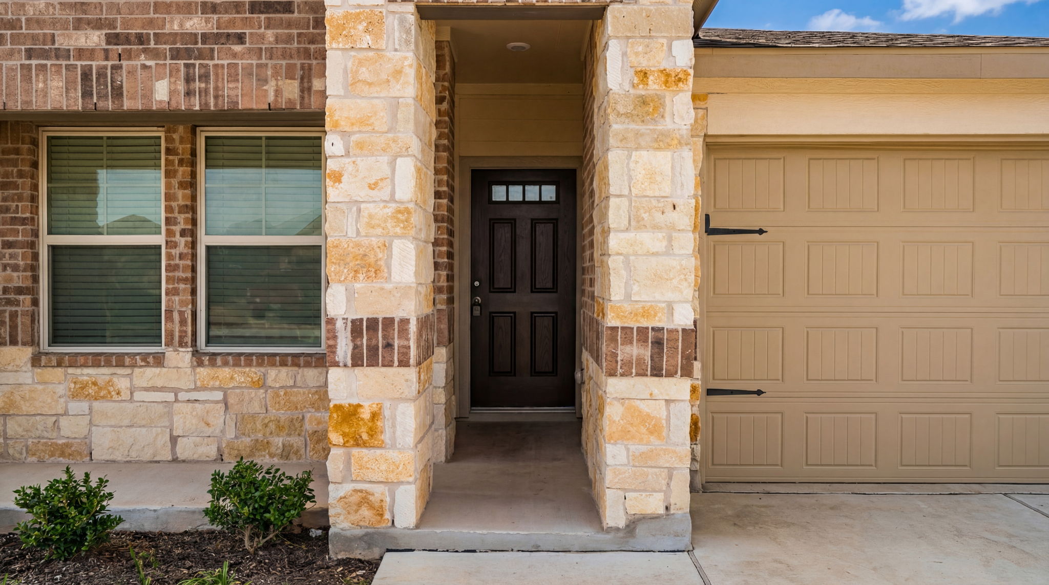1003 Round Bale Road Hutto, TX 78634 - Photo 11 of 29 View of exterior entry featuring stone siding