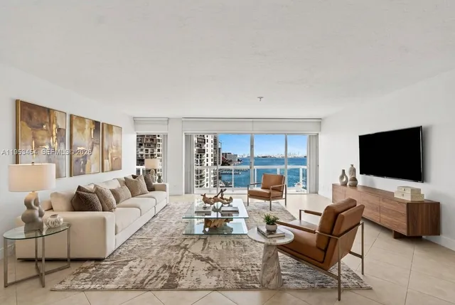 a kitchen with stainless steel appliances a stove a microwave and a sink