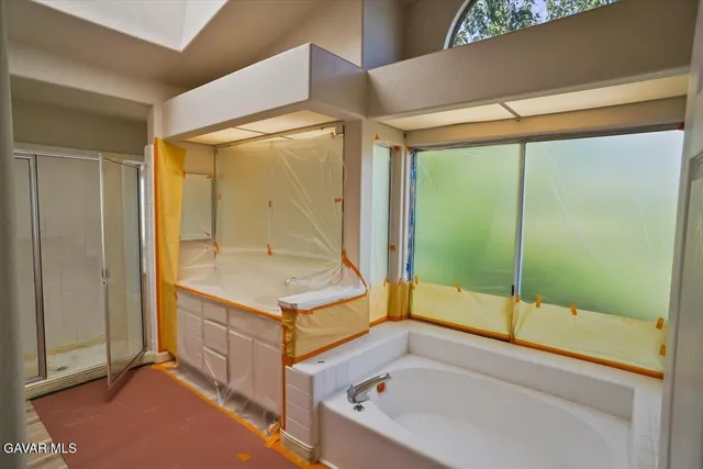 a room with window and furniture