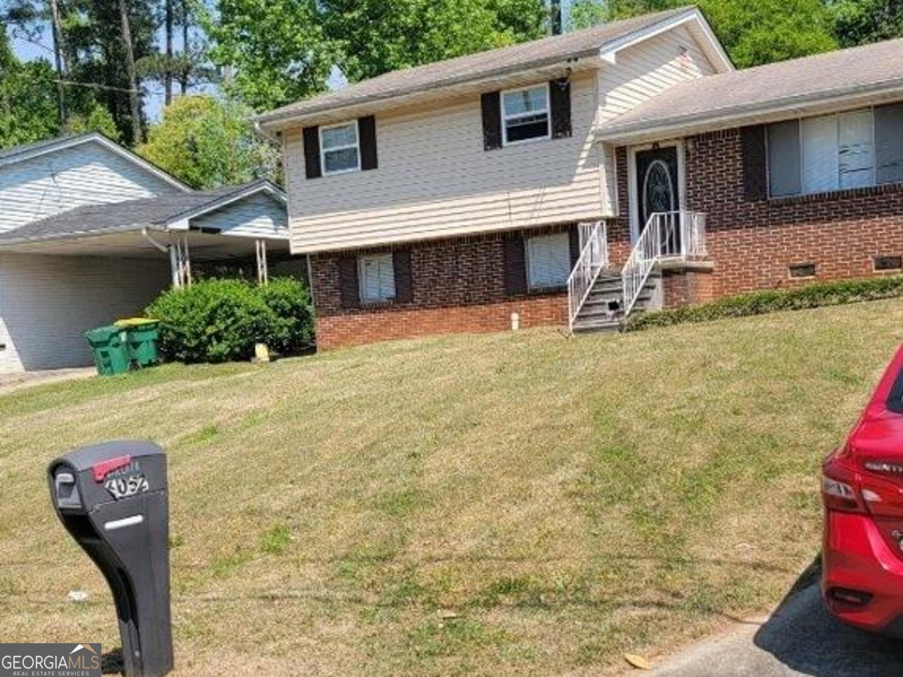 6052 Pinecreek Road Forest Park, GA 30297 - Photo 12 of 12 a view of a house with backyard and sitting area
