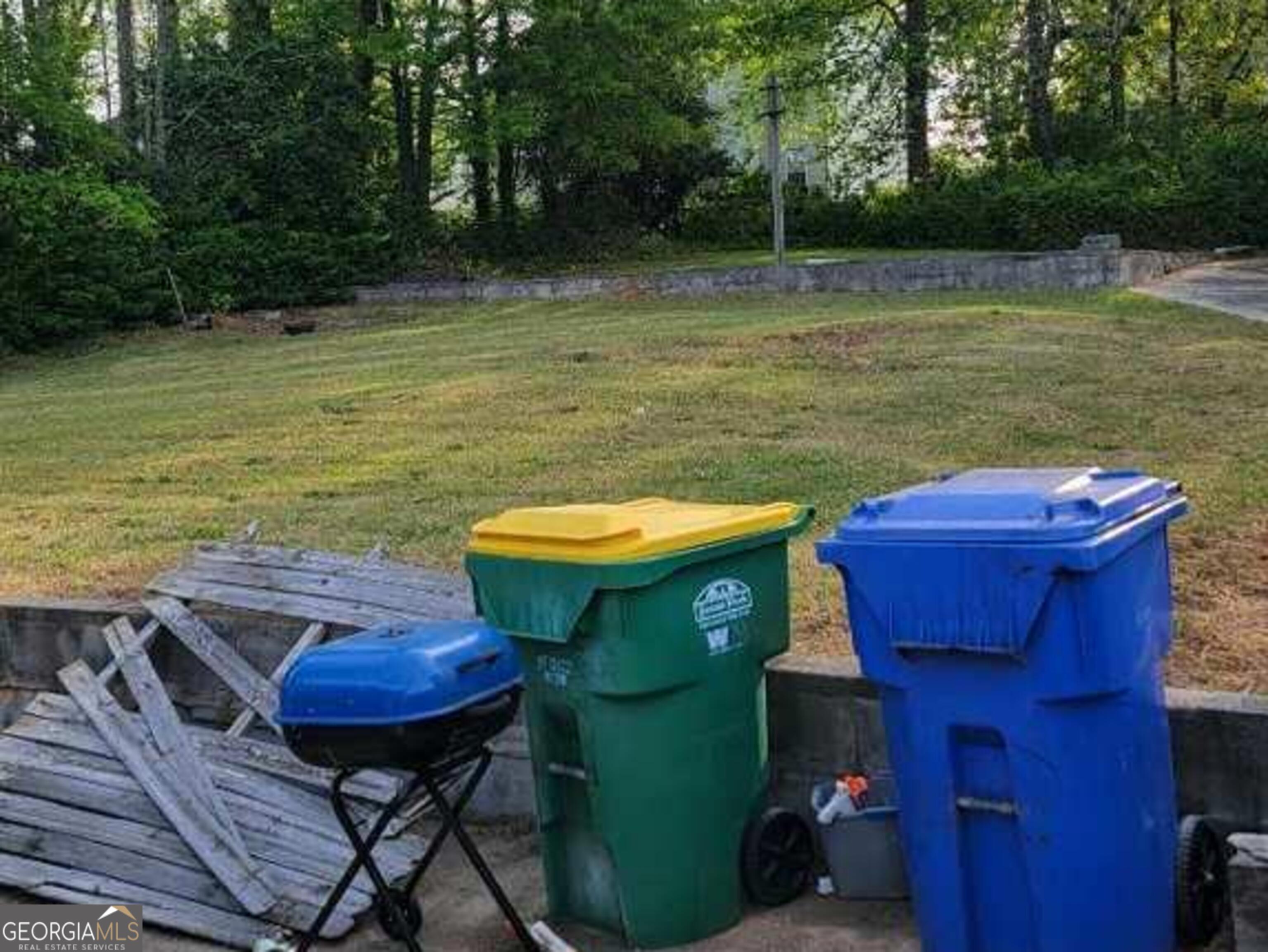 6052 Pinecreek Road Forest Park, GA 30297 - Photo 10 of 12 a view of a swimming pool with chair and table