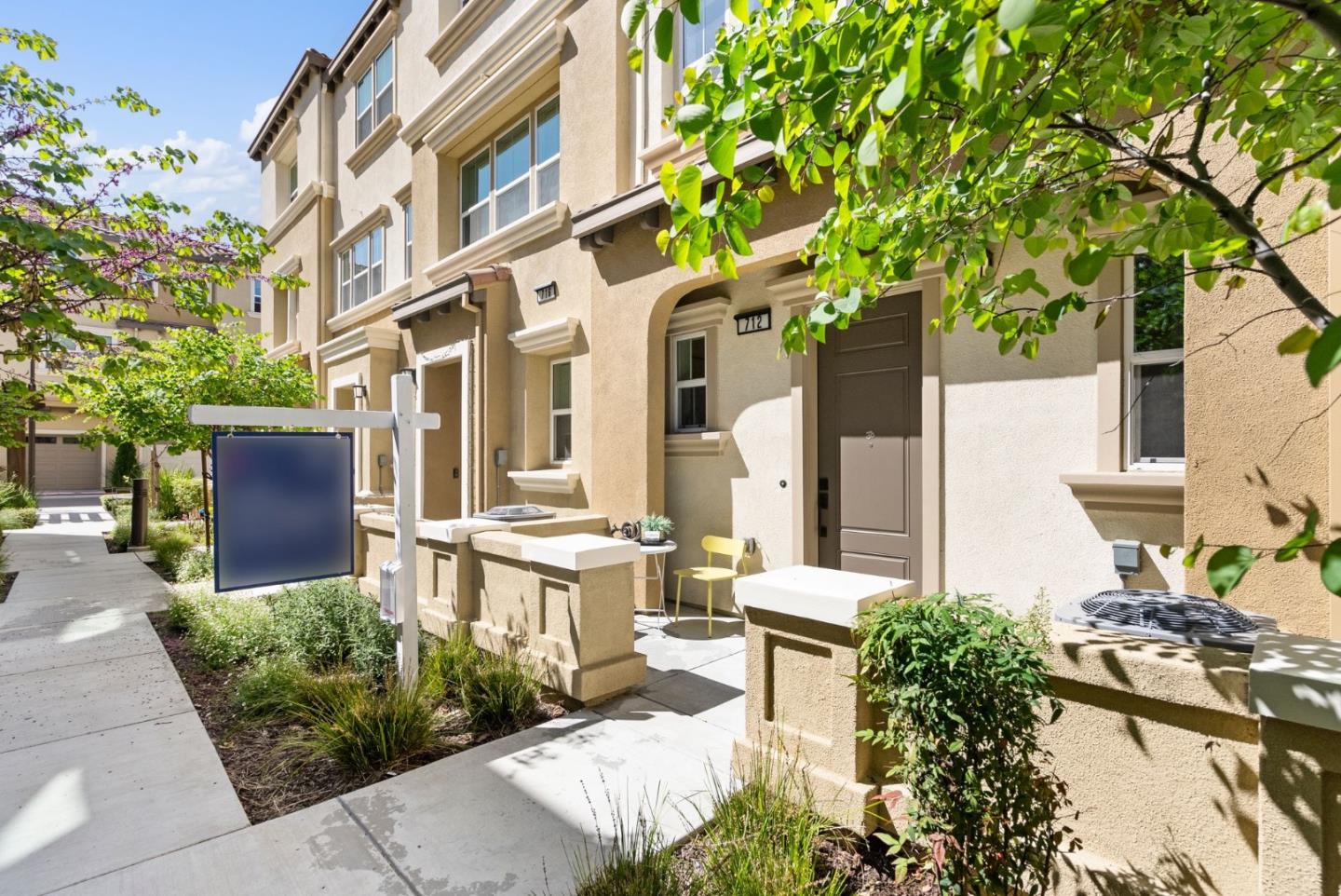 a front view of a building with garden