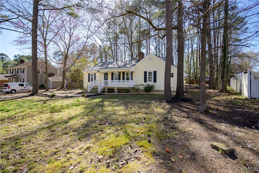 5012 Rollingway Road Chesterfield, VA 23832 - Photo 3 of 35 a front view of a house with a yard and large trees