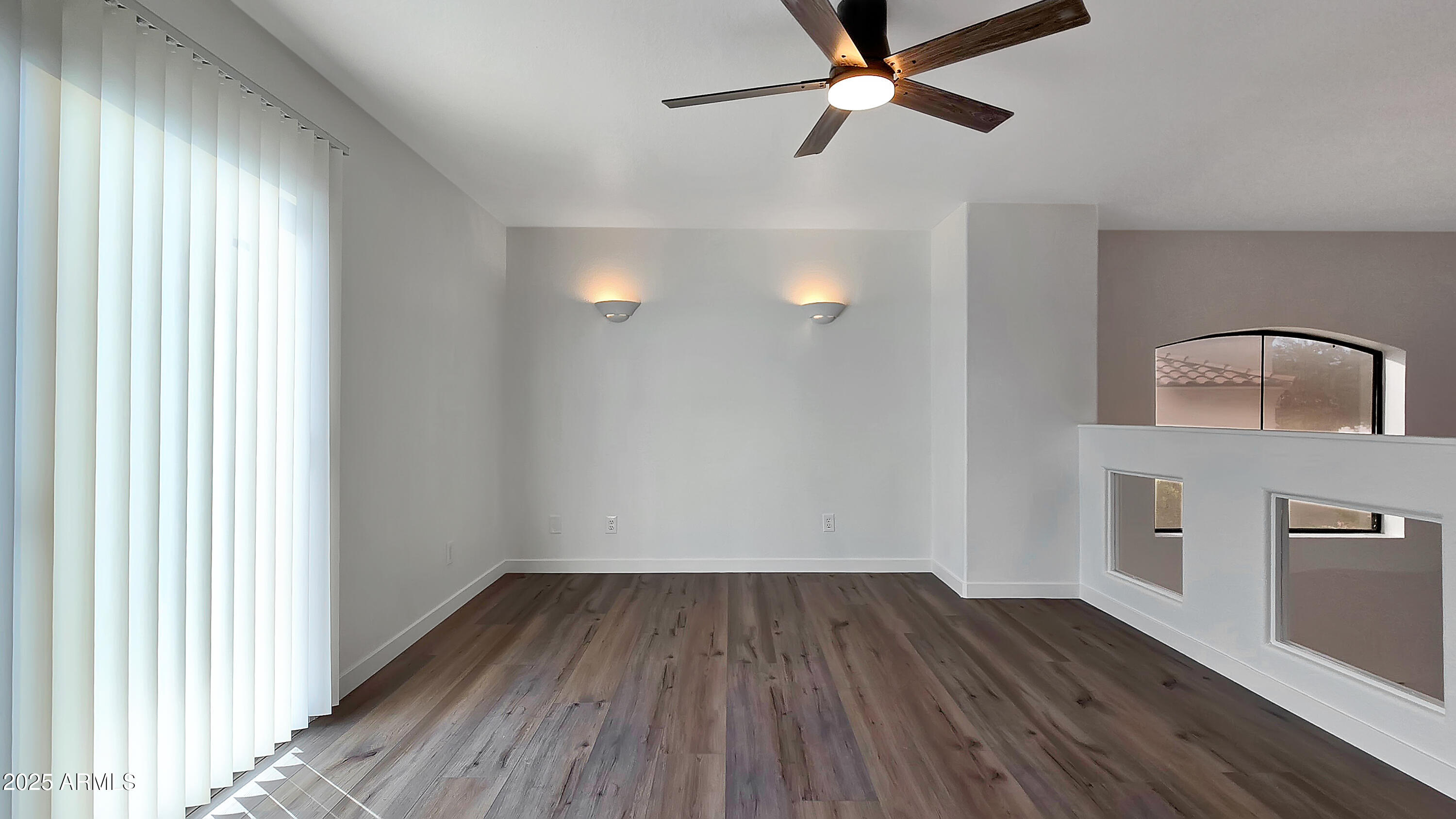 2119 West Tracy Lane Phoenix, AZ 85023 - Photo 15 of 31 a view of a livingroom with wooden floor and a ceiling fan
