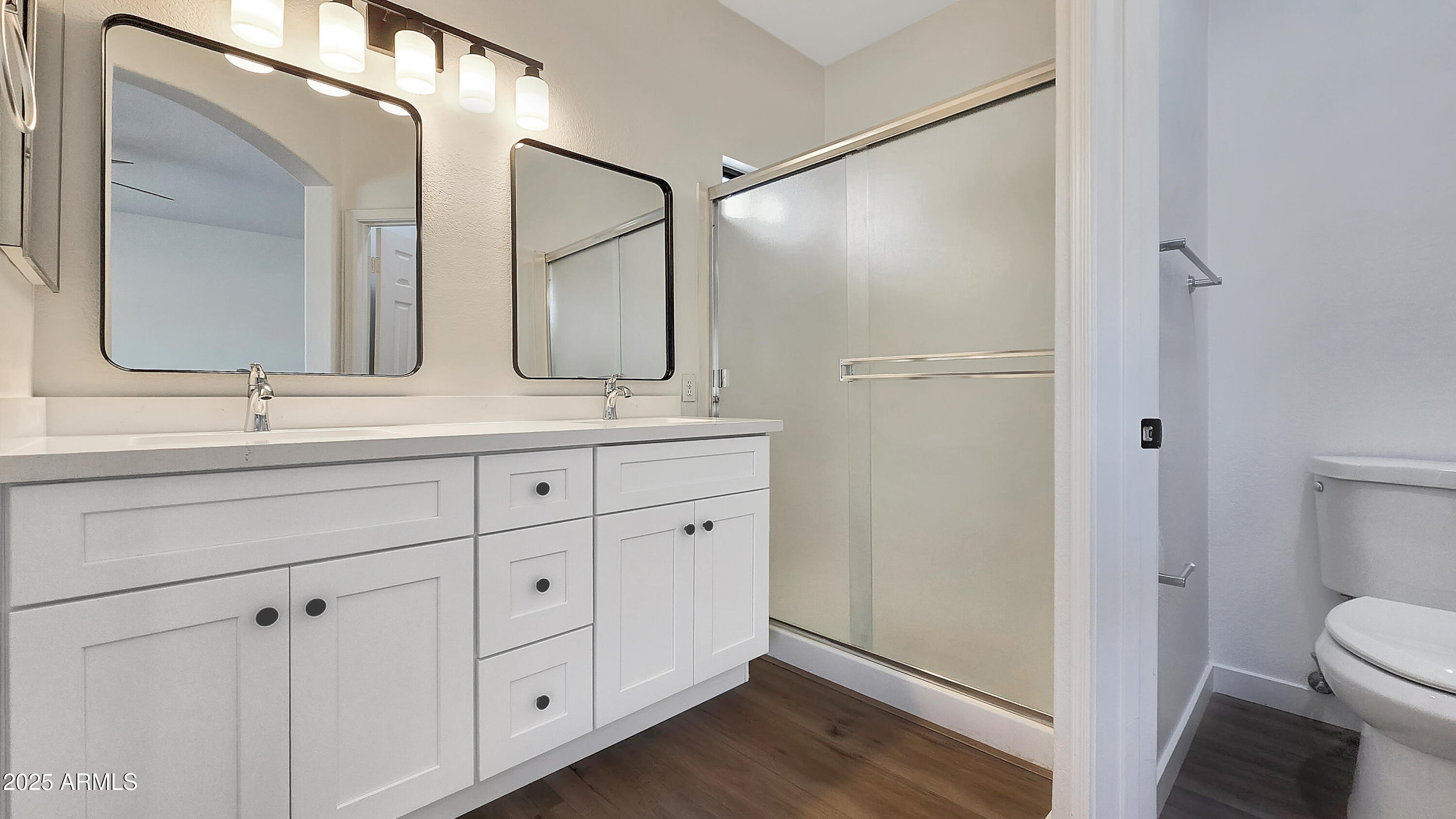 2119 West Tracy Lane Phoenix, AZ 85023 - Photo 22 of 31 a bathroom with a double vanity sink mirror and toilet